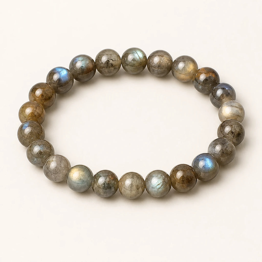 Moonlit Labradorite bracelet with blue-green flash on an ivory background