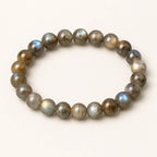Moonlit Labradorite bracelet with blue-green flash on an ivory background