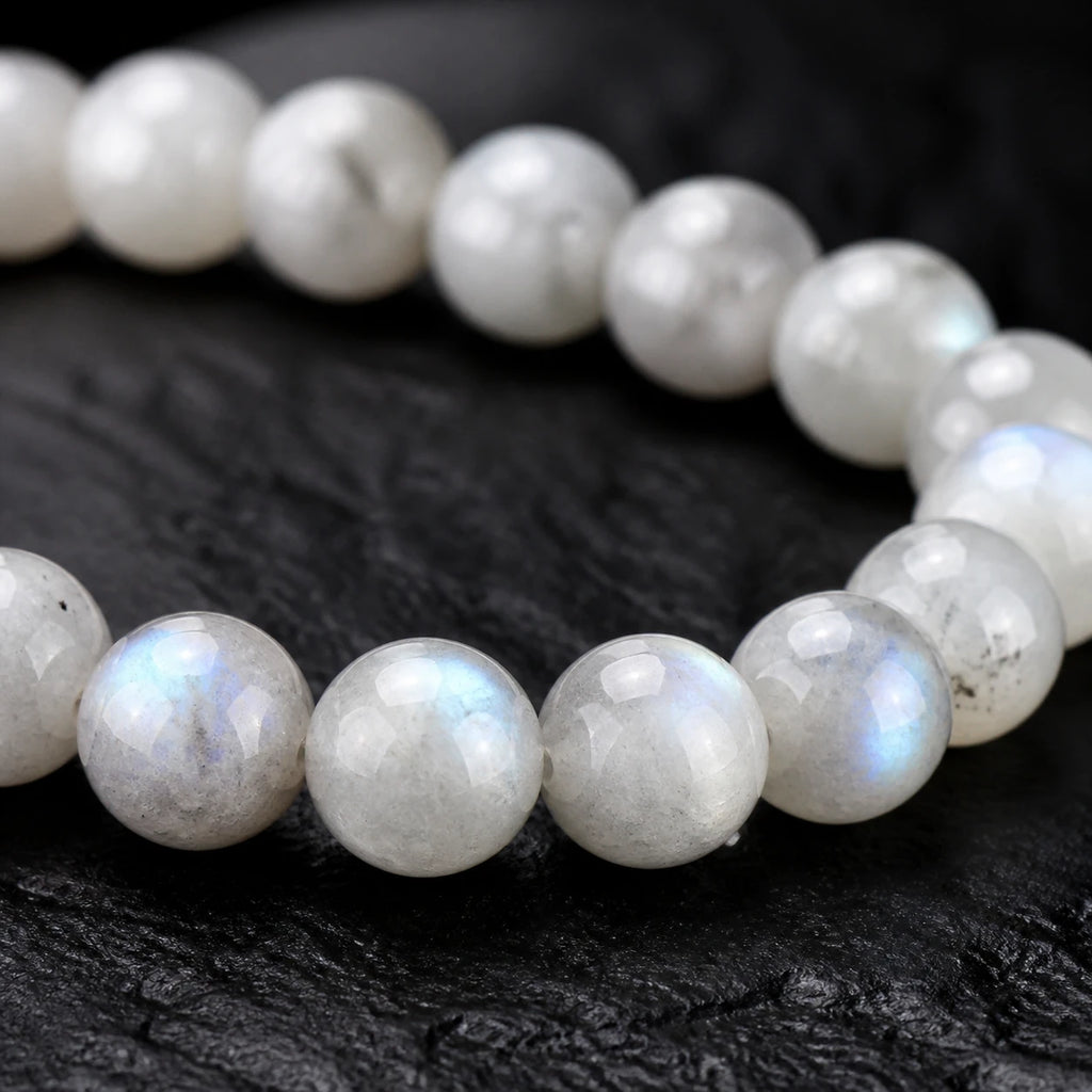 Close-up of pale labradorite beads with natural blue-silver flash
