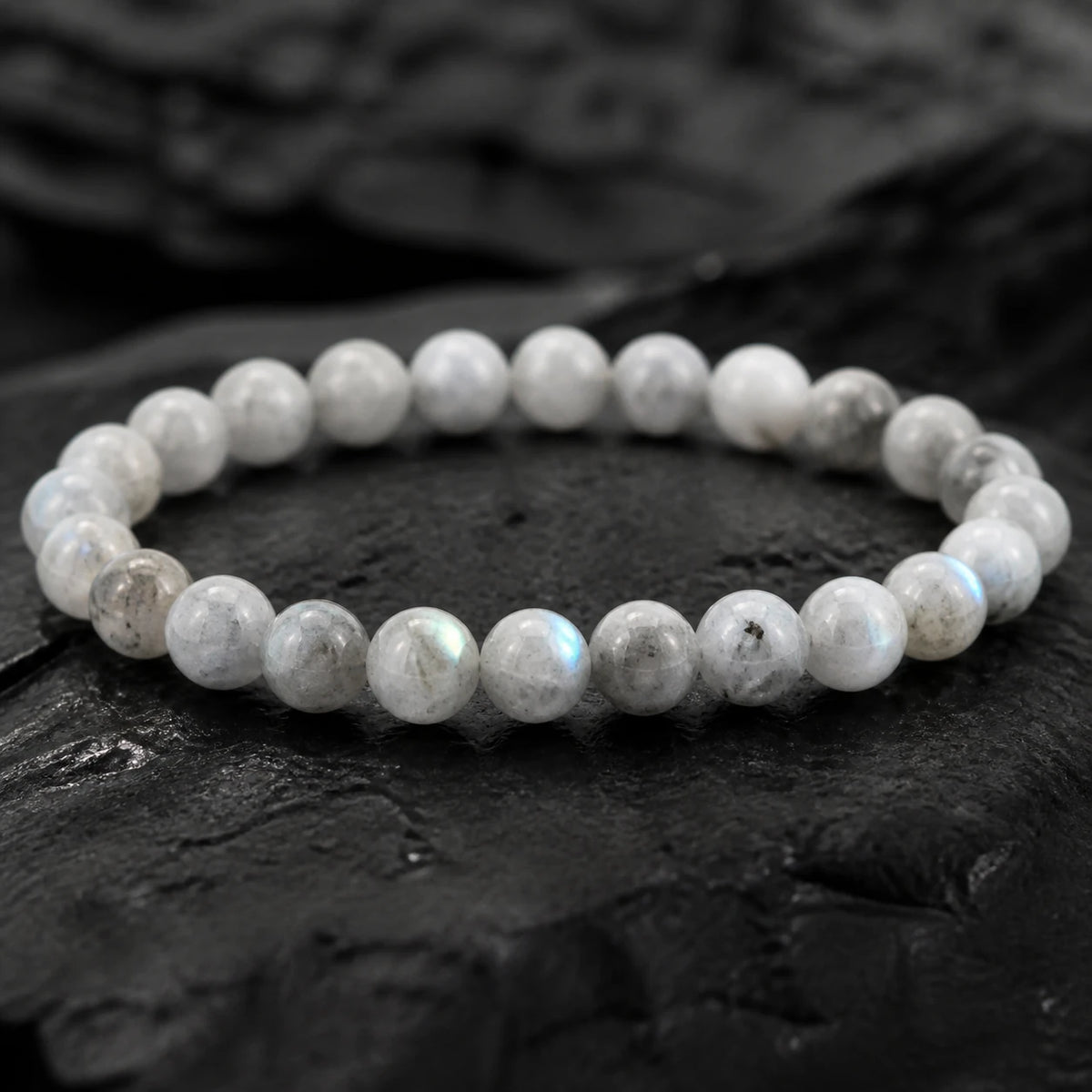 Detailed pale gray labradorite bead texture and subtle blue-green sheen