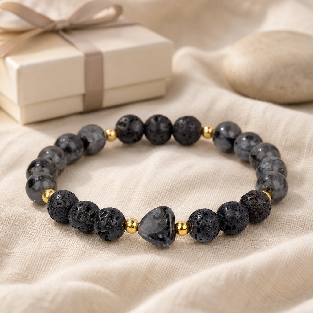 Moonlit Heart bracelet displayed with an ivory gift box on linen