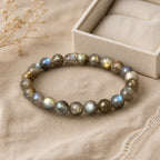 Moonlit Labradorite bracelet displayed beside an ivory gift box on linen