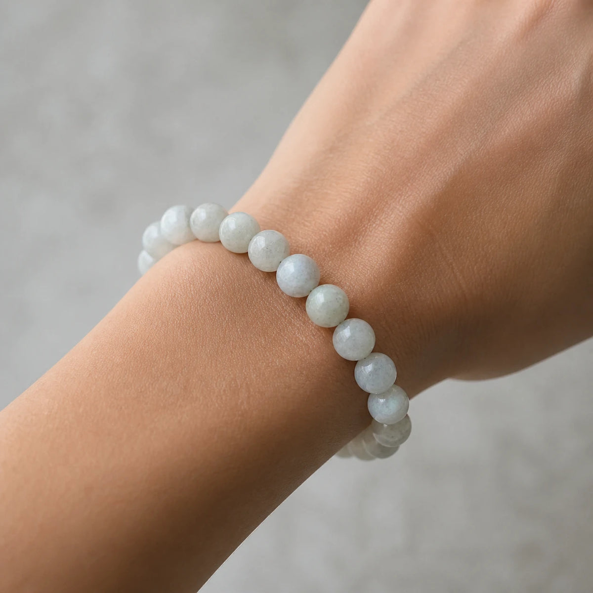 Pale labradorite bead bracelet worn on an adult wrist