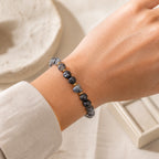 Moonlit Heart gemstone and lava stone bracelet worn on wrist