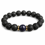 Minimalist black lava bead bracelet with blue galaxy stone centerpiece on white background, spiritual gemstone bracelet for calm and balance.
