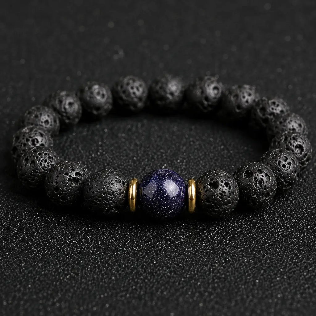 Blue goldstone and lava stone bracelet with gold accents for calm focus, protection, and everyday grounding.