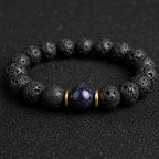 Blue goldstone and lava stone bracelet with gold accents for calm focus, protection, and everyday grounding.