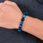 Mariv Stones Blue Tiger Eye Beaded Bracelet Worn on Wrist for Everyday Style, Calm Energy and Modern Jewelry Fashion.