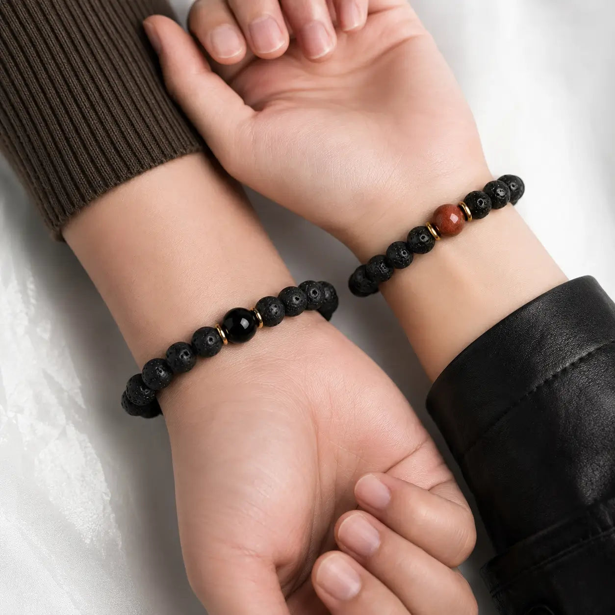 Unisex lava stone bead bracelets worn on wrist, minimalist natural stone jewelry for grounding and protection.