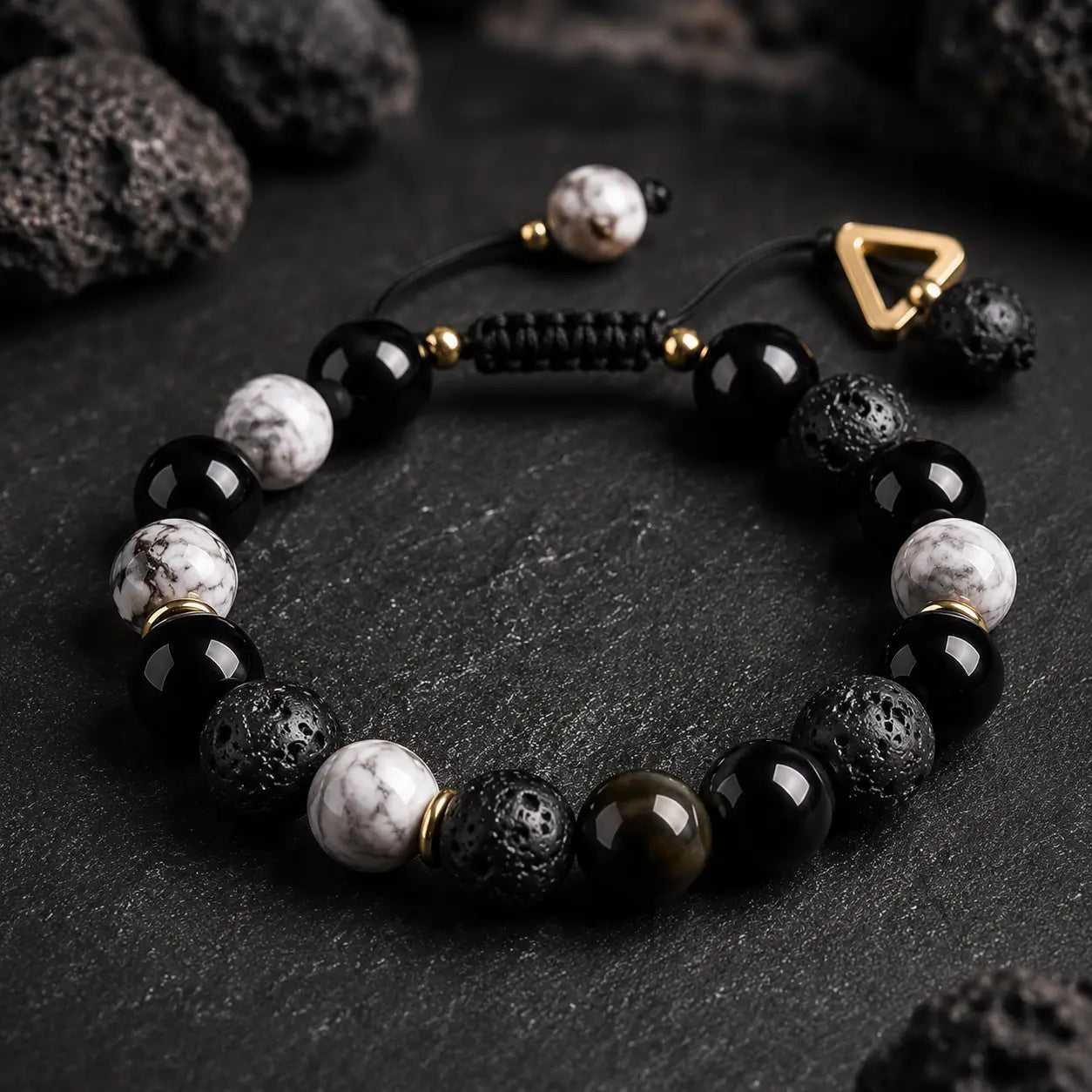 Handmade lava stone bracelet with black onyx and white howlite beads for grounding, protection, and calm energy.