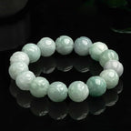 High-quality lotus carving detail on white jade beads.