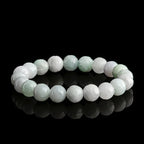 Full view of white and green Burmese jade lotus stretch bracelet.