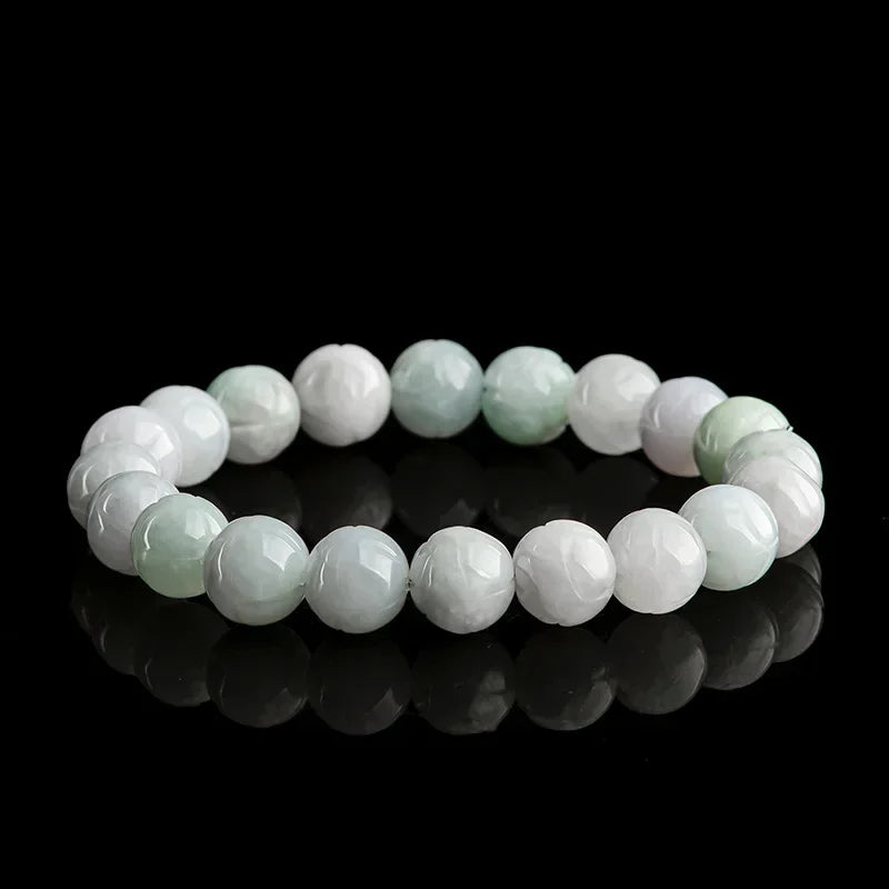 Full view of white and green Burmese jade lotus stretch bracelet.
