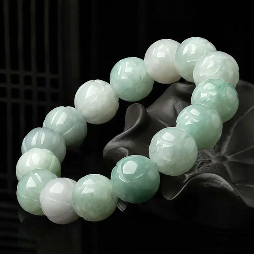 Woman wearing natural Burmese jade lotus beaded bracelet.