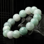 Woman wearing natural Burmese jade lotus beaded bracelet.