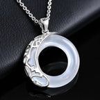 Moonstone halo pendant necklace with sterling silver detailing by Mariv Stones.