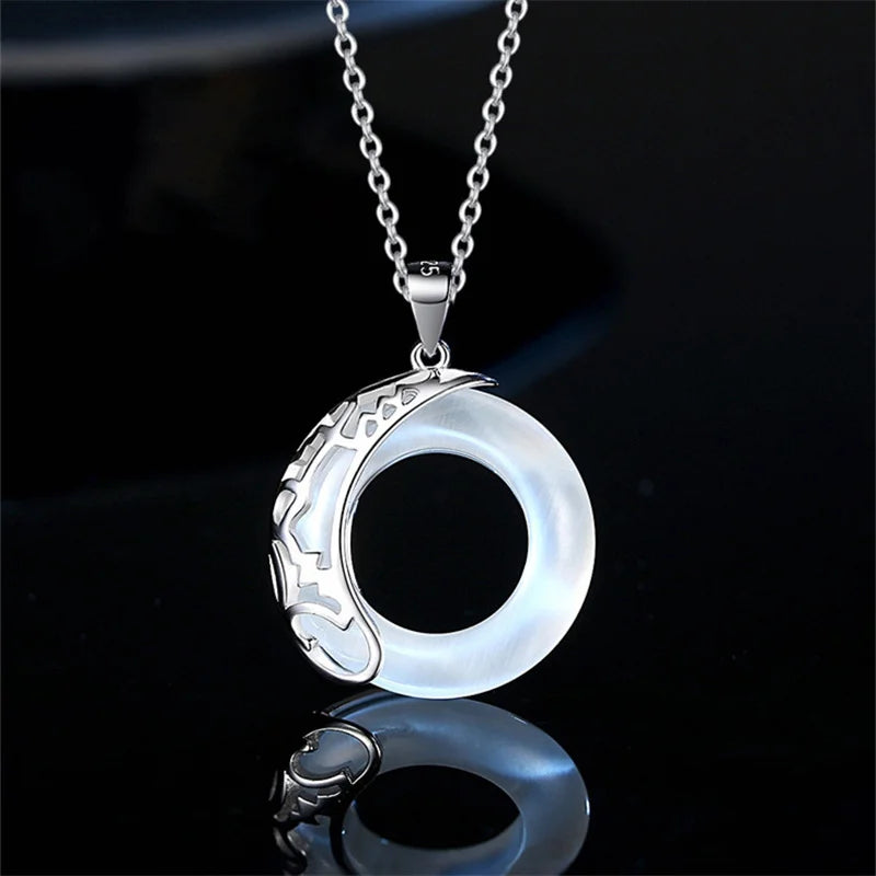 Front view of moonstone halo pendant necklace by Mariv Stones.