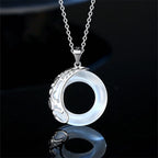 Front view of moonstone halo pendant necklace by Mariv Stones.