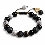 Natural volcanic rock bead bracelet with gold spacer details on white background, modern unisex gemstone jewelry for mindfulness and daily style.