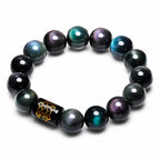 Rainbow Eye Obsidian Protection Bracelet on white background, featuring rainbow sheen beads for grounding and protection.