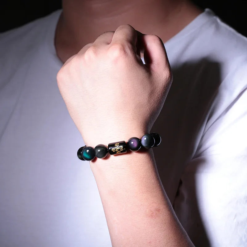 Rainbow Eye Obsidian Protection Bracelet worn on the wrist for everyday style and comfort.