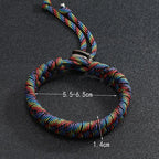 Rainbow handwoven paracord bracelet worn on wrist for casual outdoor style