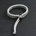 Close up detail of silver grey handwoven paracord bracelet craftsmanship