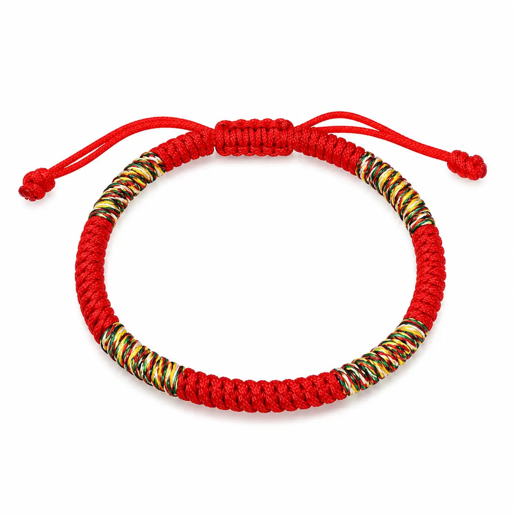 Handmade Tibetan lucky knot red string bracelet with colorful woven accents, adjustable braided cord design for everyday wear and good fortune.
